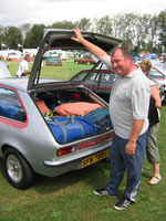 Phil Moorcroft stands by a Chevette HS stuffed with camping gear